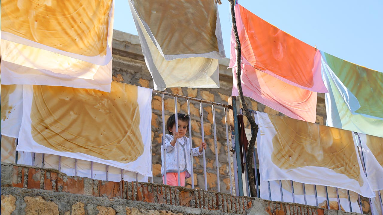 Villagers make pestil in Mardin, Turkey