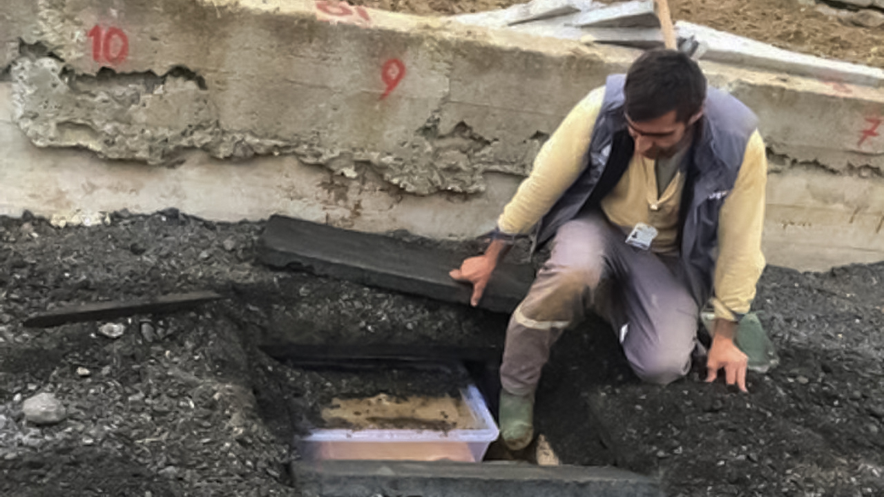 Remains of Kurdish fighters in plastic boxes numbered 1-18 found under a pavement