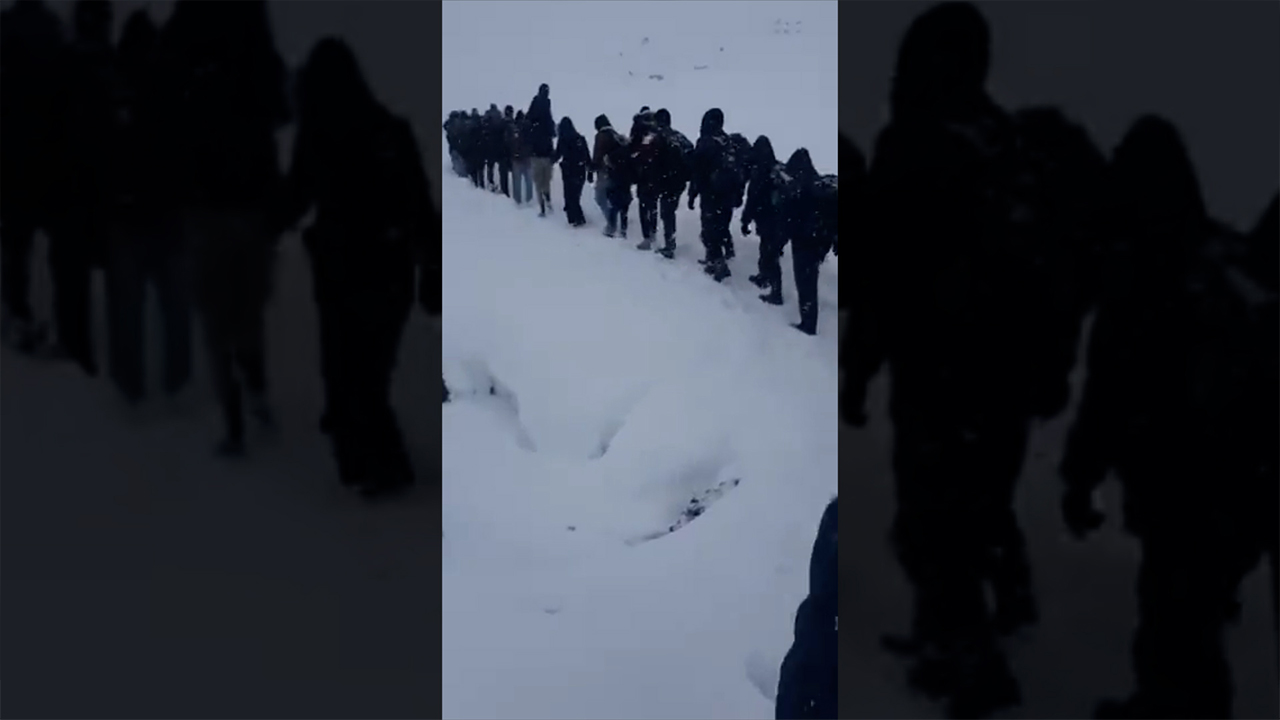 Hundreds of refugees from Afghanistan recorded walking in snowstorm at Turkey-Iran border