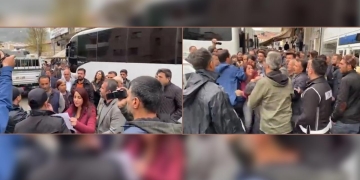 Turkish police drag away woman reading out press statement