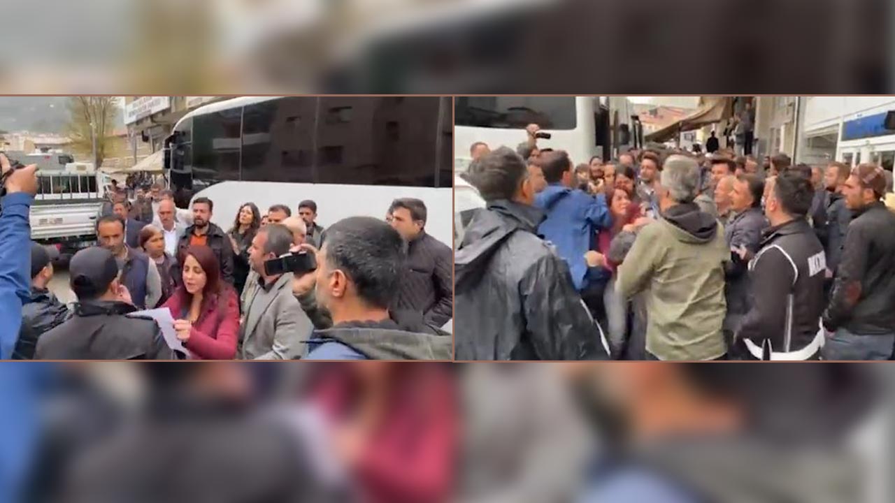 Turkish police drag away woman reading out press statement