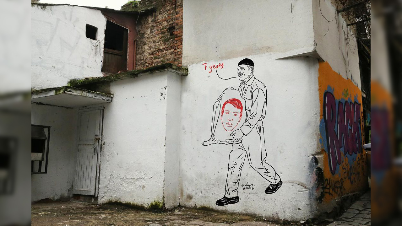 Italian artist depicts moment bereaved father receives son’s bones in plastic bag