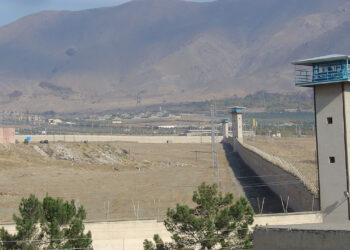 Iranian prisoner dies after guards open fire on inmates, more than 100 injured