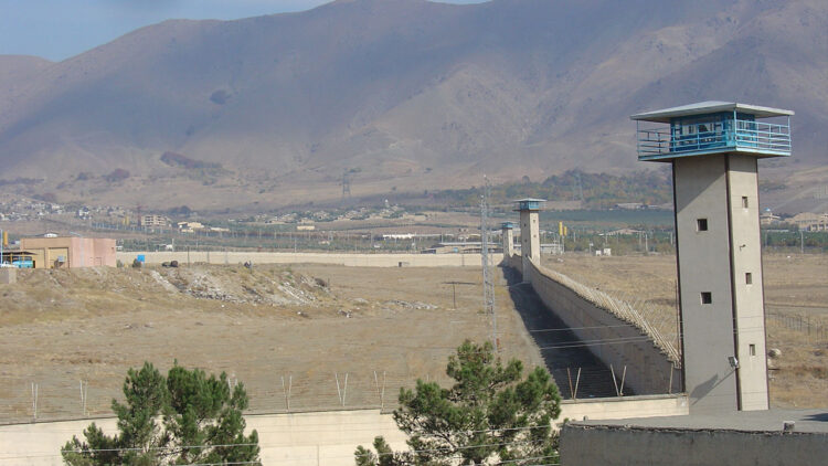 Iranian prisoner dies after guards open fire on inmates, more than 100 injured