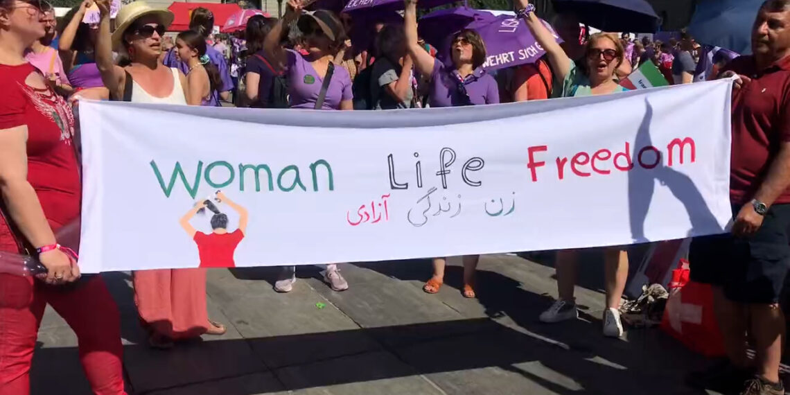 Women in Switzerland rally against inequality, embracing slogan ‘Jin Jiyan Azadî’