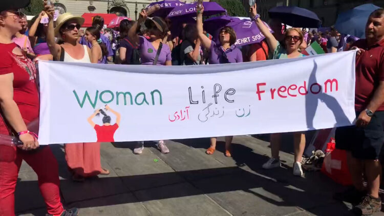 Women in Switzerland rally against inequality, embracing slogan ‘Jin Jiyan Azadî’