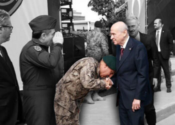 Turkish police officers line up to kiss hand of far-right leader