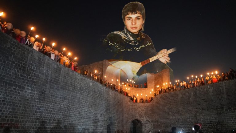 Women light Newroz fire on Diyarbakır’s ancient walls, honouring Kurdish resistance